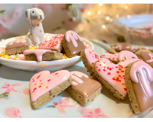 "Handmade allergy-friendly vegan dog cookies in heart-shaped designs from the Cordially Yours gift set."